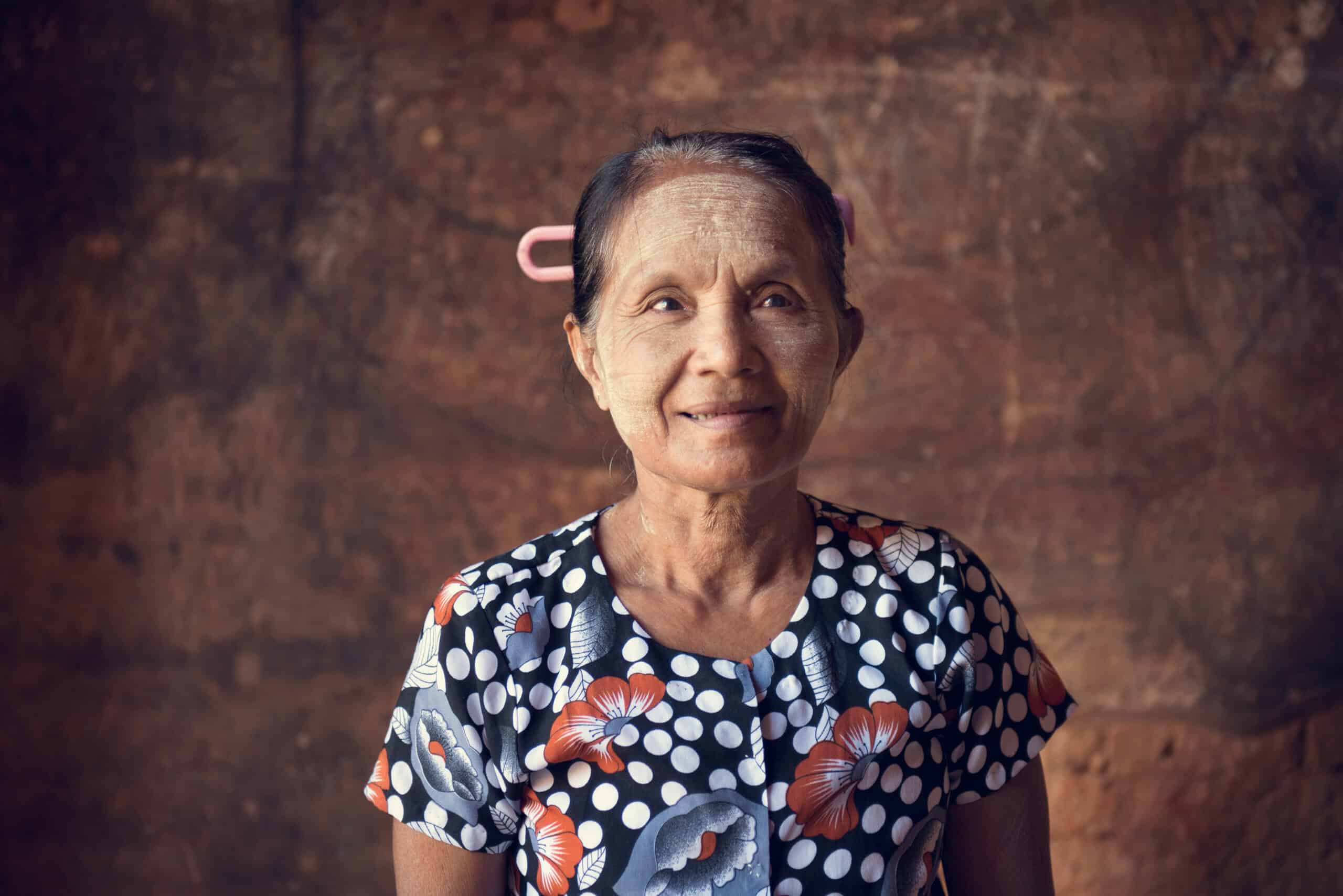 Older person smiling hopefully